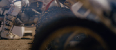 a group of dirt bikes parked next to each other