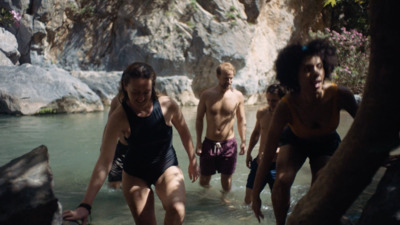 a group of people are wading in the water