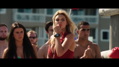 a woman in a red swimsuit holding a microphone