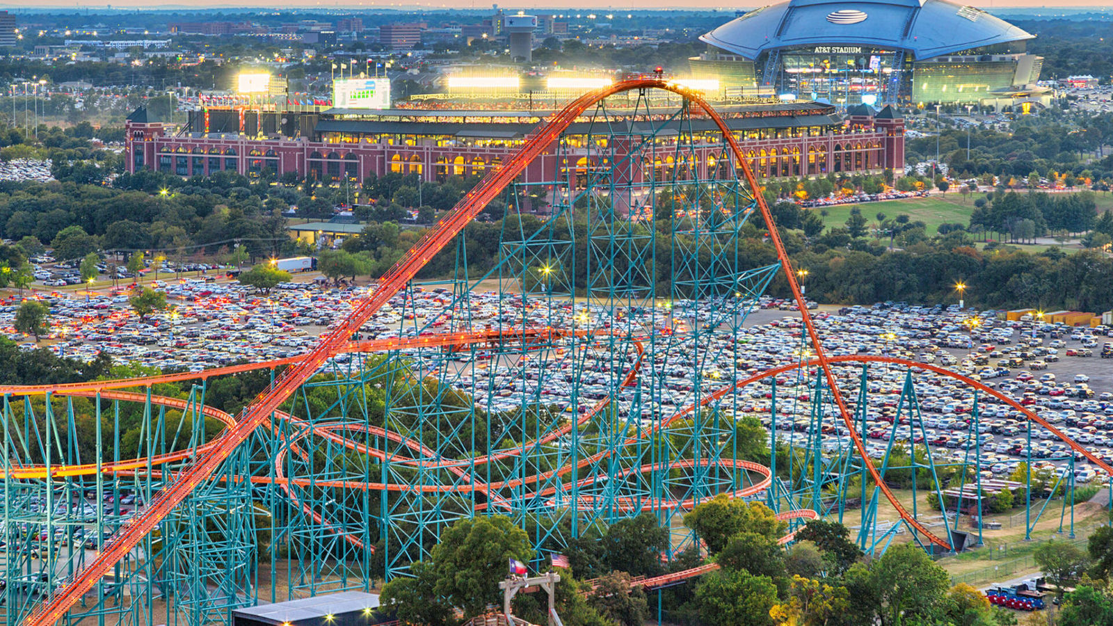 an aerial view of a roller coaster at a theme park