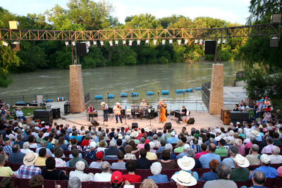 a group of people standing on top of a stage