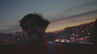 a man with a beard and a red shirt