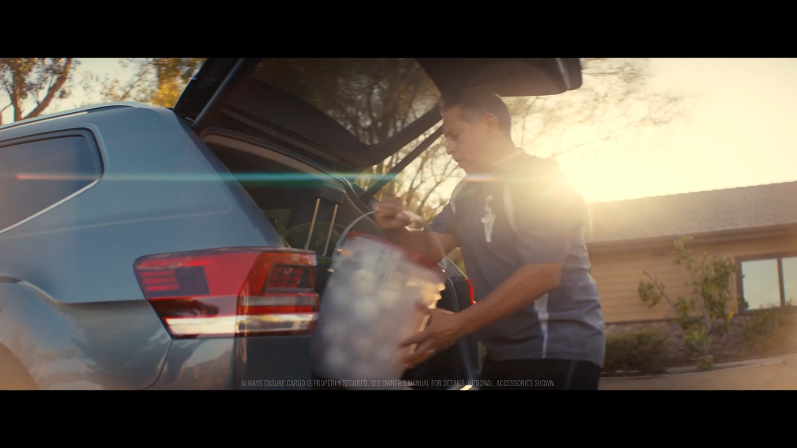 a man standing next to a parked car