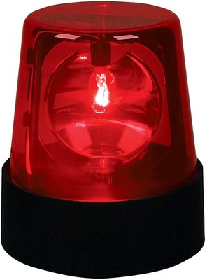 a red light that is on top of a black stand