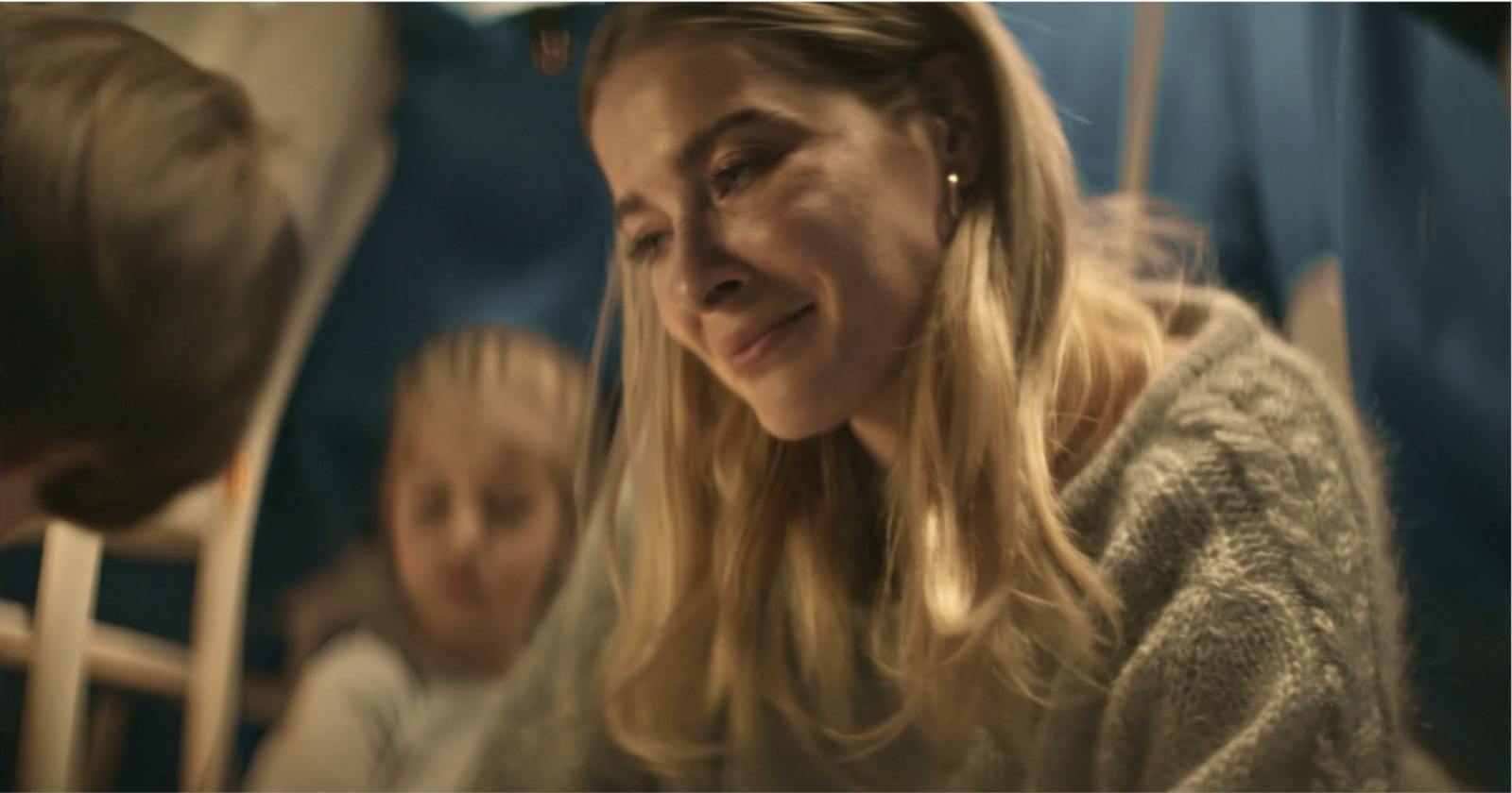 a woman sitting next to a child on a bus