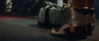 a close up of a person's shoes on the ground