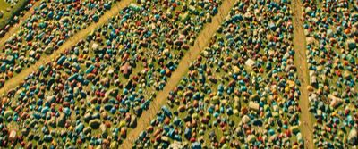 a large group of people standing in a field