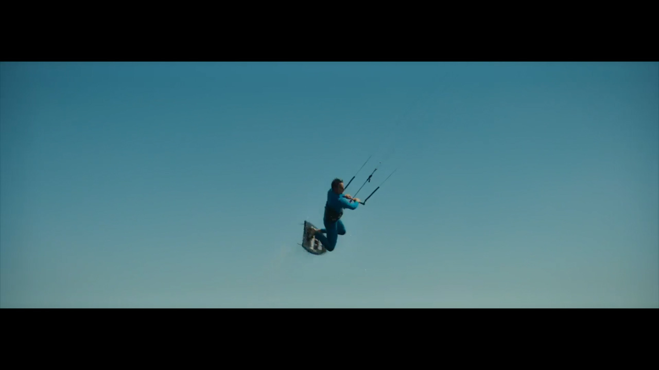 a man flying through the air while riding skis