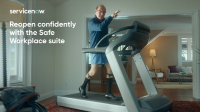 a man standing on a treadmill in a living room