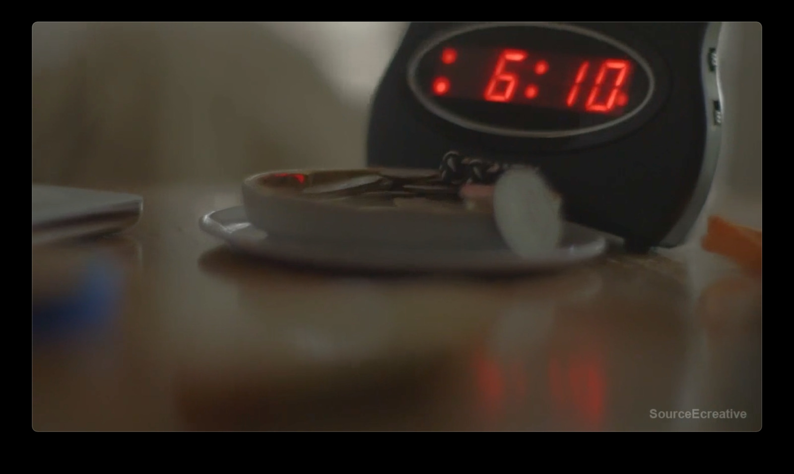 a digital clock sitting on top of a table