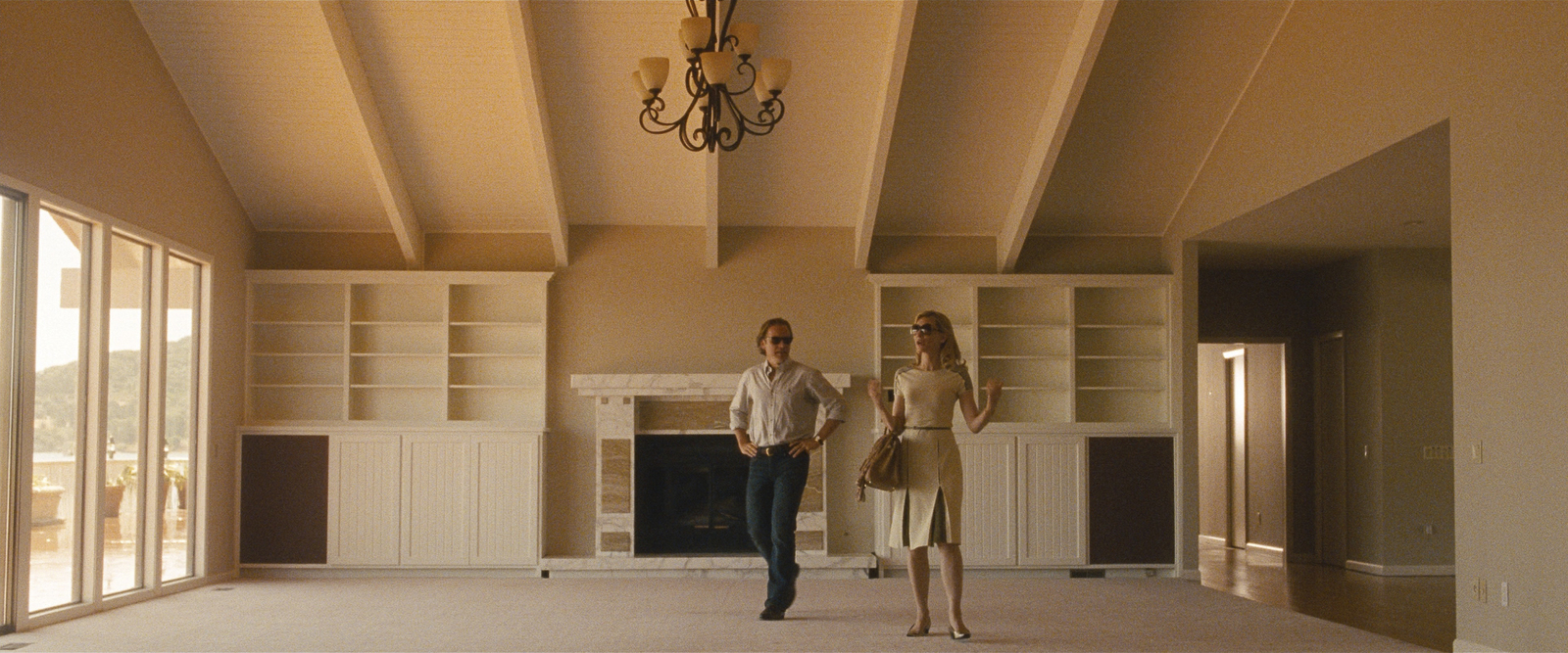 a man and a woman standing in a living room