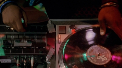 a dj spinning a record on a turntable