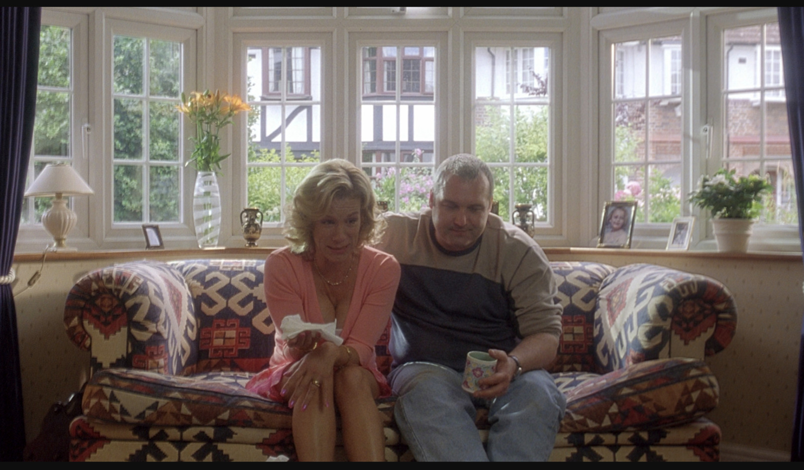 a man and a woman sitting on a couch