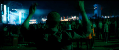 a man standing in front of a crowd at a concert