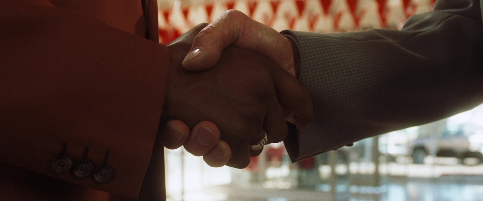 a close up of two people shaking hands