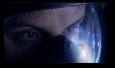 a close up of a person's eye with a space background