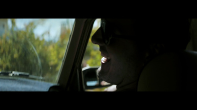 a man in a car looking out the window