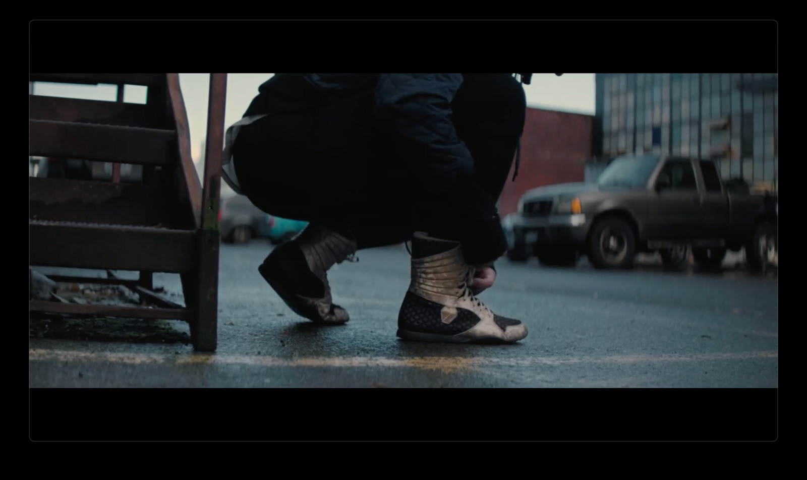 a person with their feet on a wooden bench