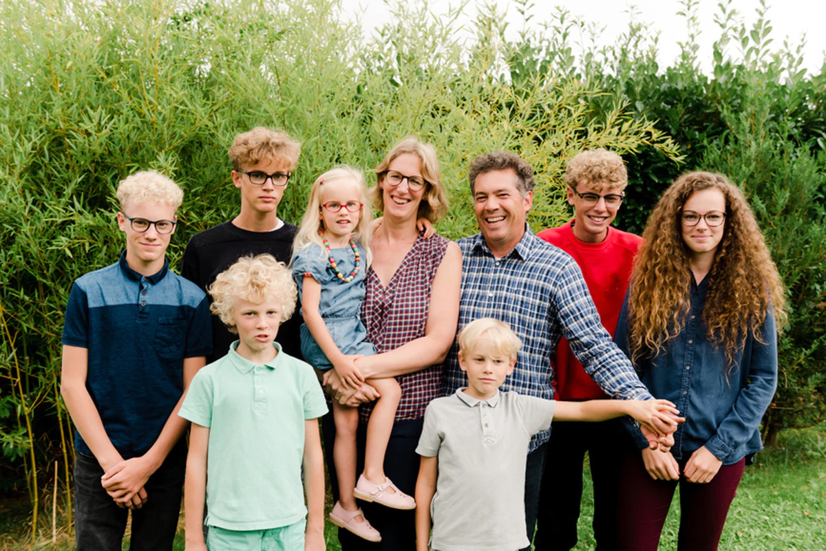 a group of people standing next to each other