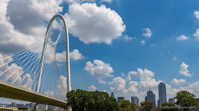 a view of a bridge with a city in the background