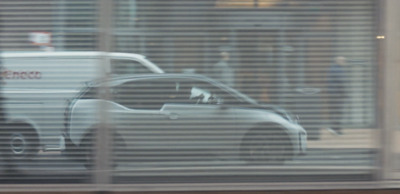 a reflection of a car in a window