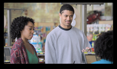 a man standing next to a woman in a store