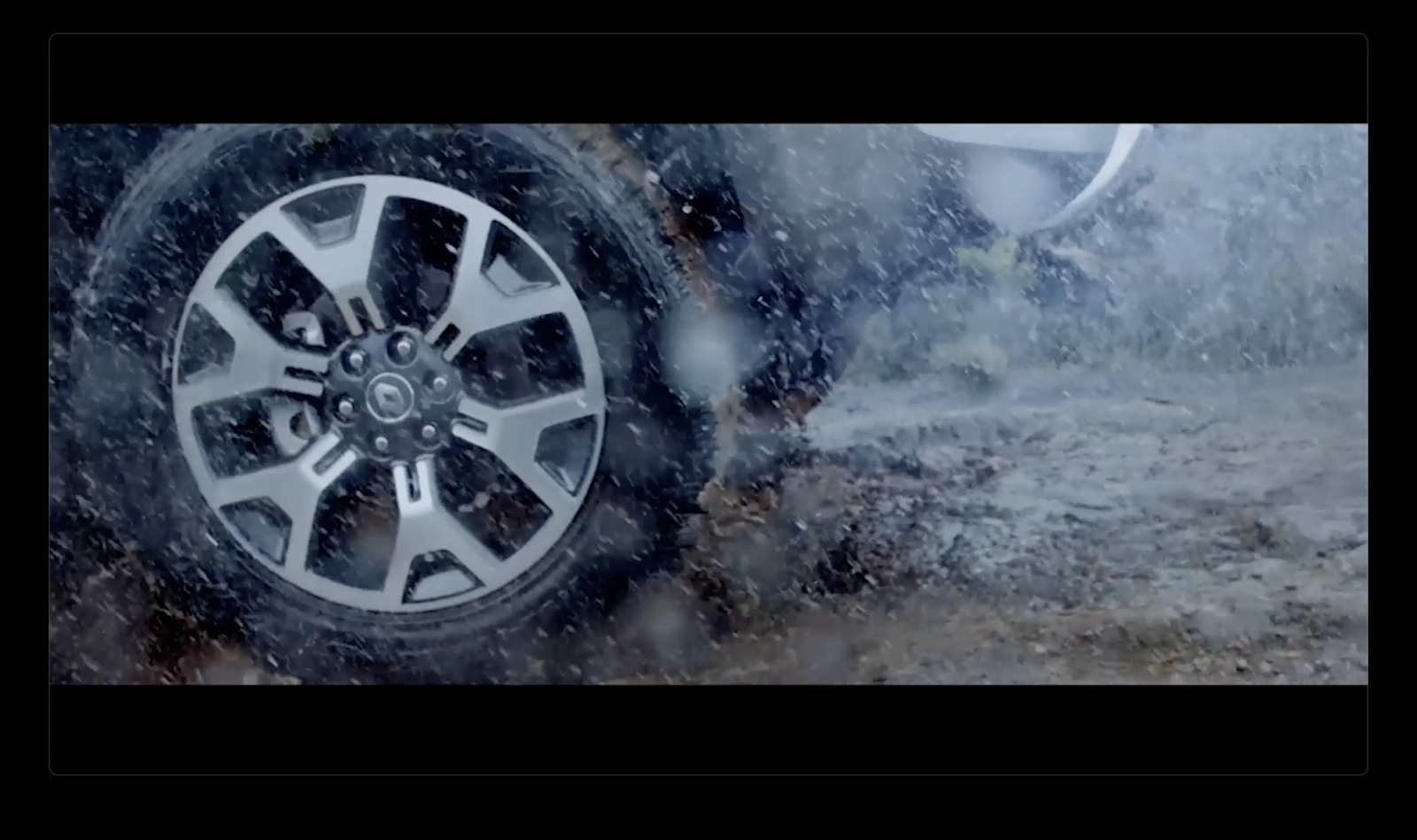 a close up of a tire on a car in the rain