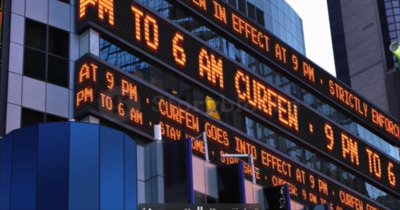 a tall building with a lot of signs on it