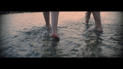 a couple of people that are standing in the water