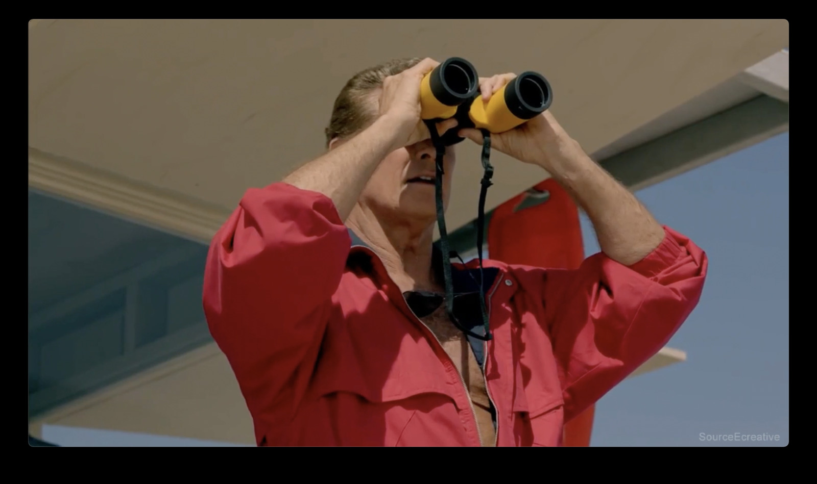 a woman looking through a pair of binoculars