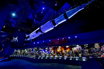 a space shuttle is suspended from the ceiling of a museum