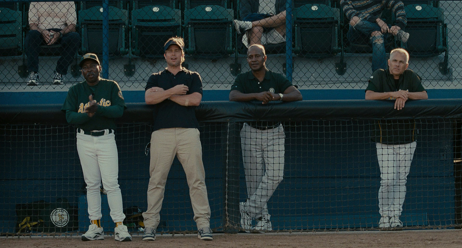 a group of men standing next to each other on a baseball field