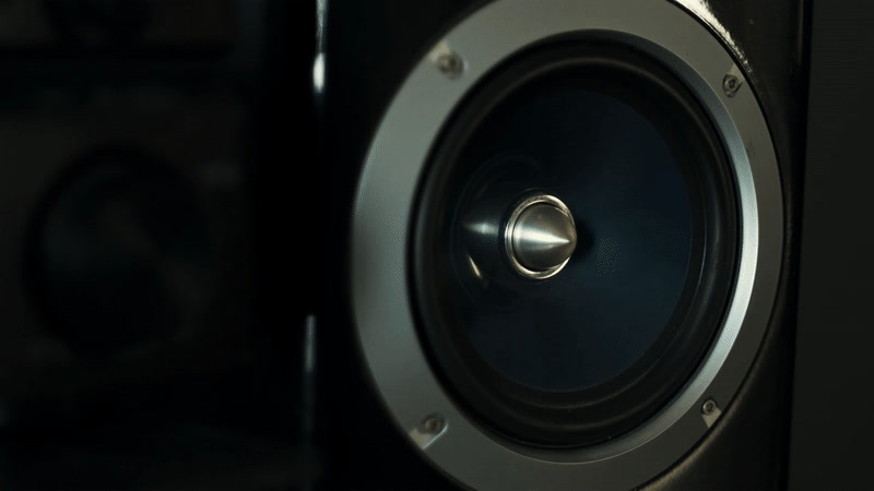 a close up of a speaker with a black background