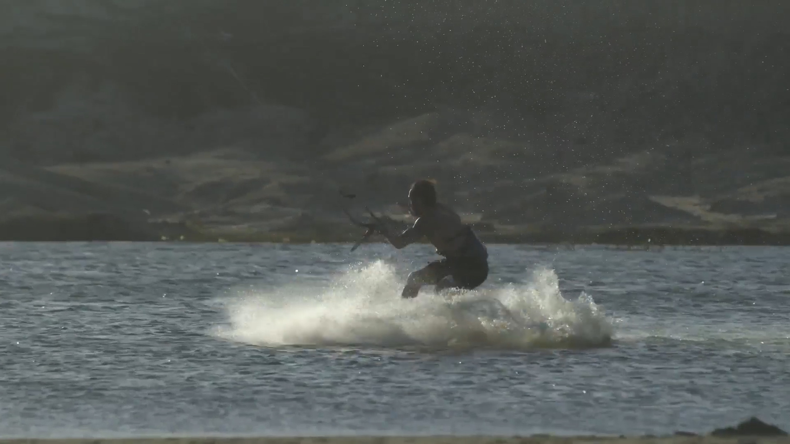 a man riding a wave on top of a surfboard