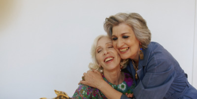 an older woman hugging a younger woman