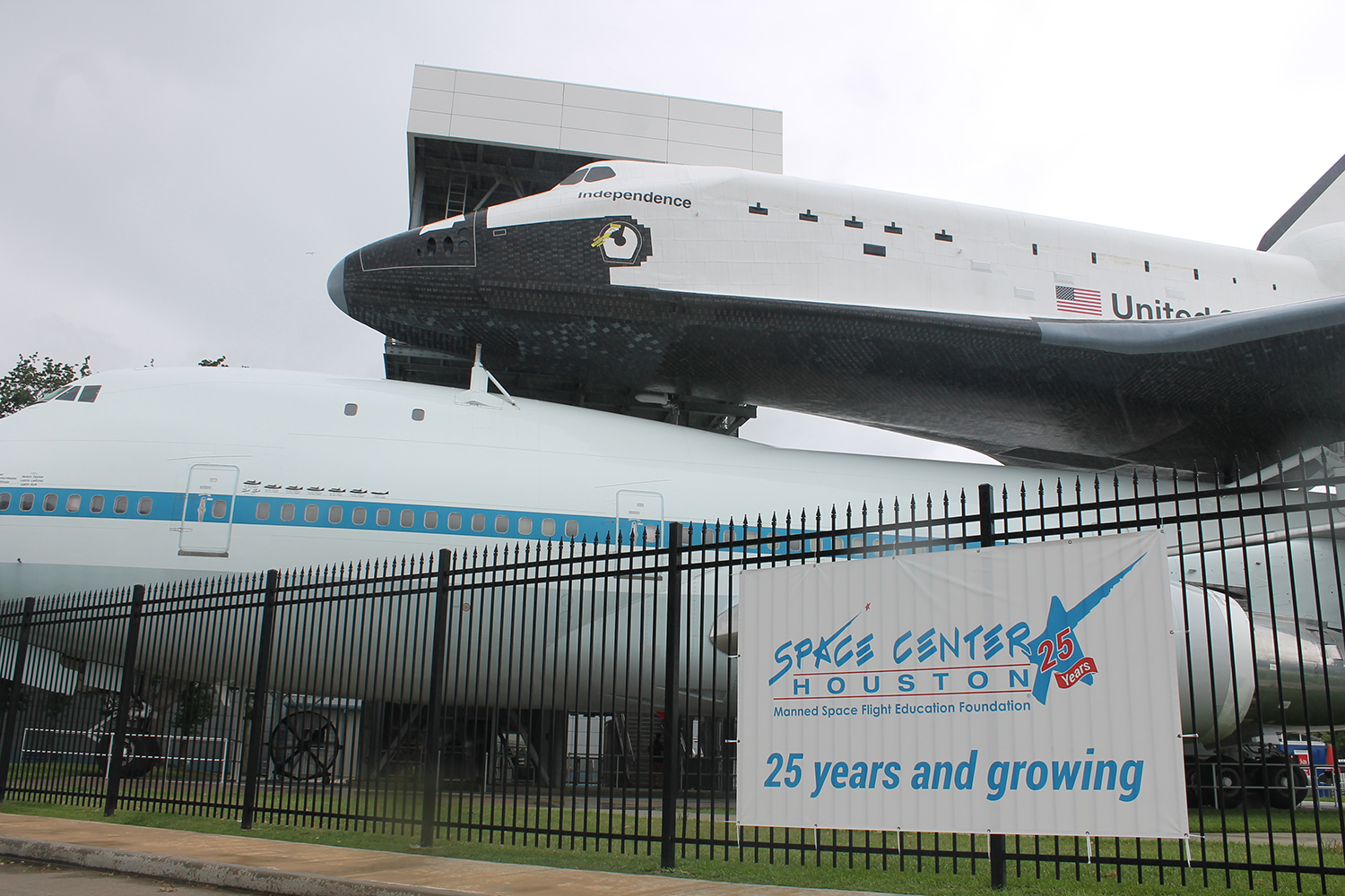 a space shuttle on top of a large airplane