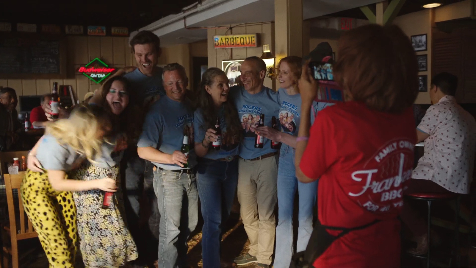 a group of people standing around each other