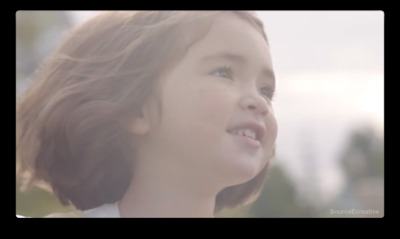 a close up of a child's face with a blurry background