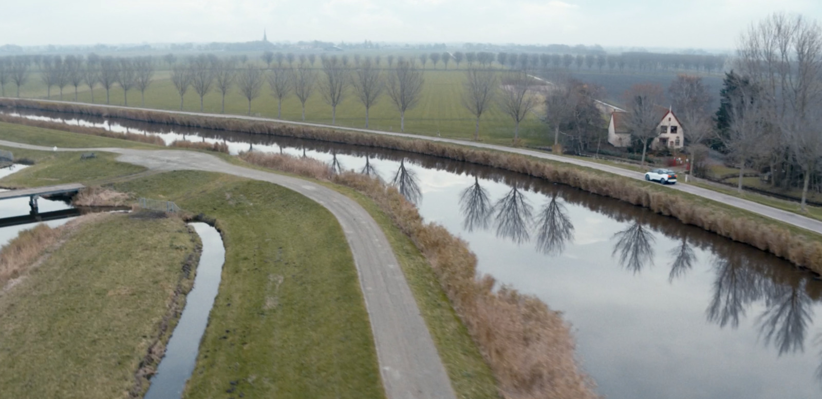 a river running through a lush green countryside