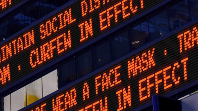 a building with a lot of electronic signs in front of it