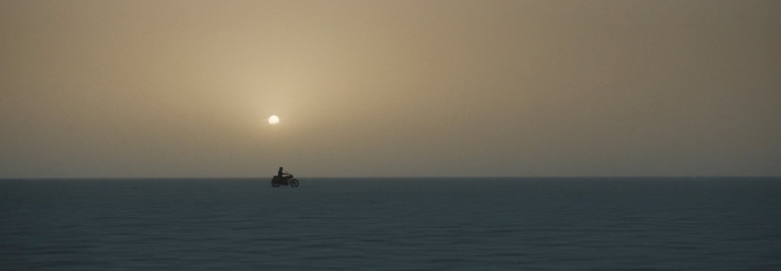 a lone boat in the middle of a large body of water