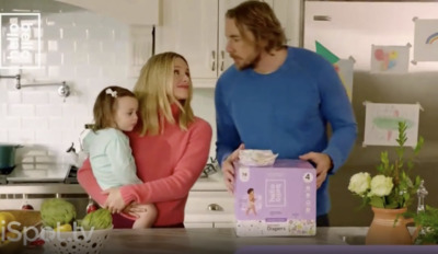 a woman and a child standing in a kitchen