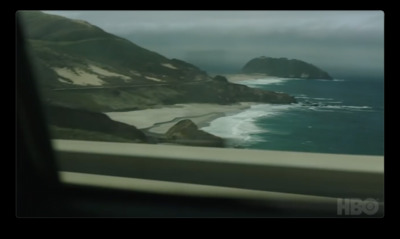 a view of the ocean from inside a vehicle