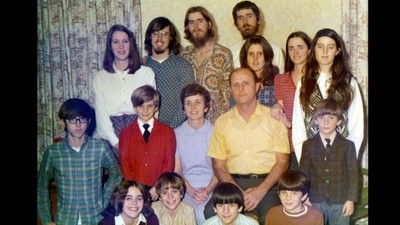 a group of people are posing for a picture