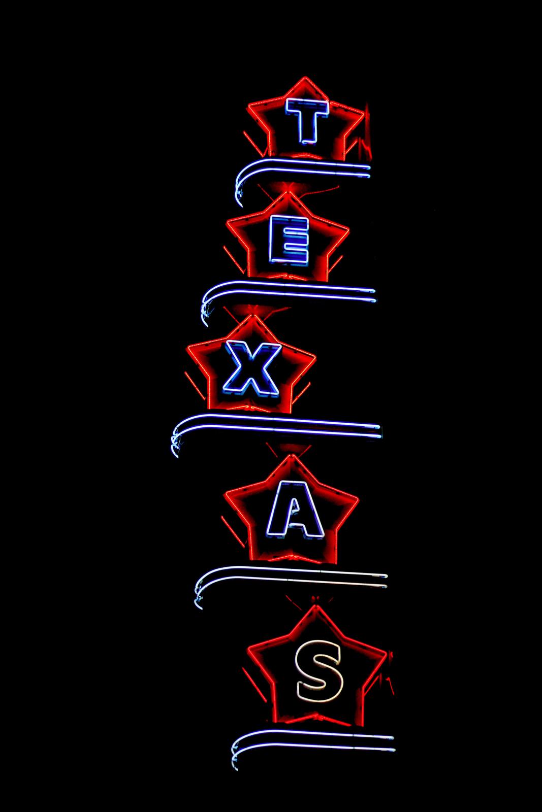 a black background with a red and blue neon sign