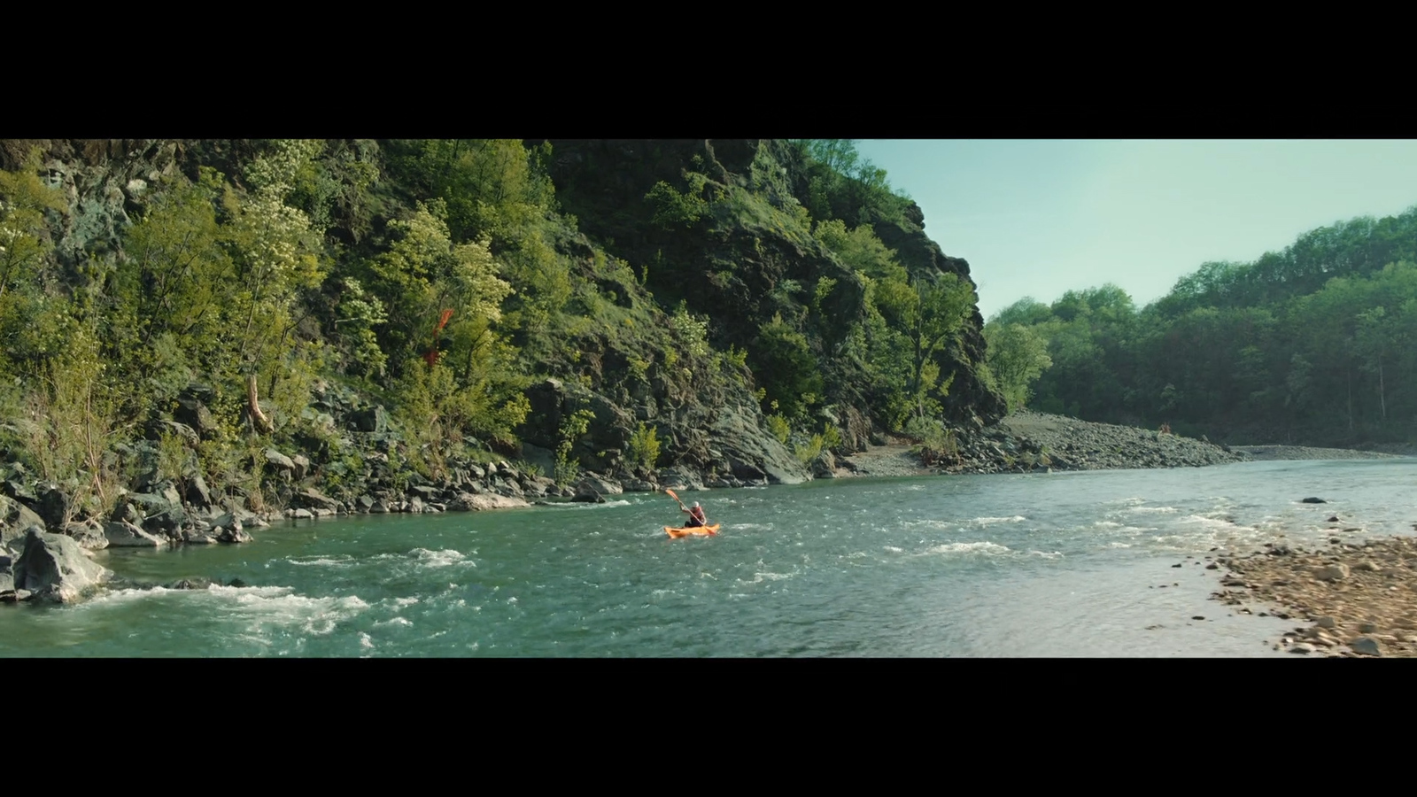 a person in a kayak on a river