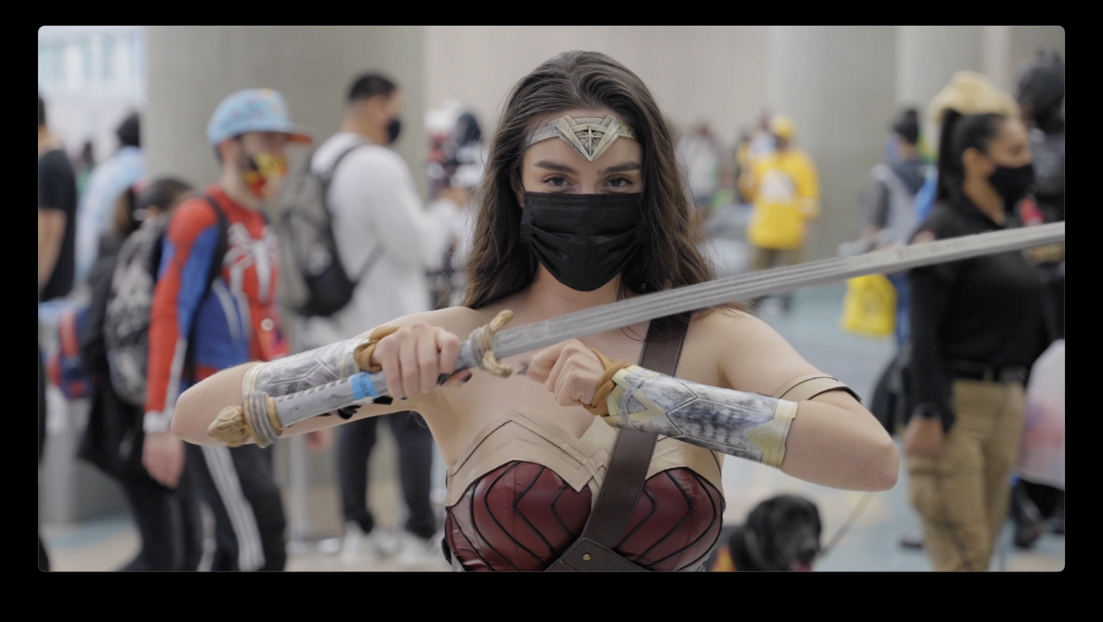 a woman in a cosplay outfit holding two swords