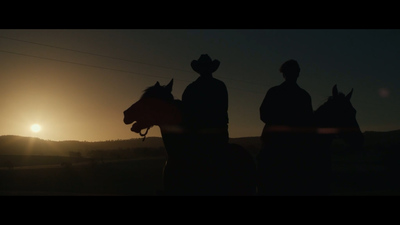 a couple of people riding on the back of horses