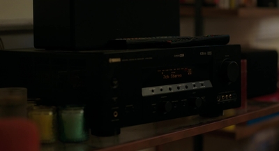 a stereo sitting on top of a shelf in a room