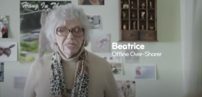 an older woman wearing glasses and a scarf